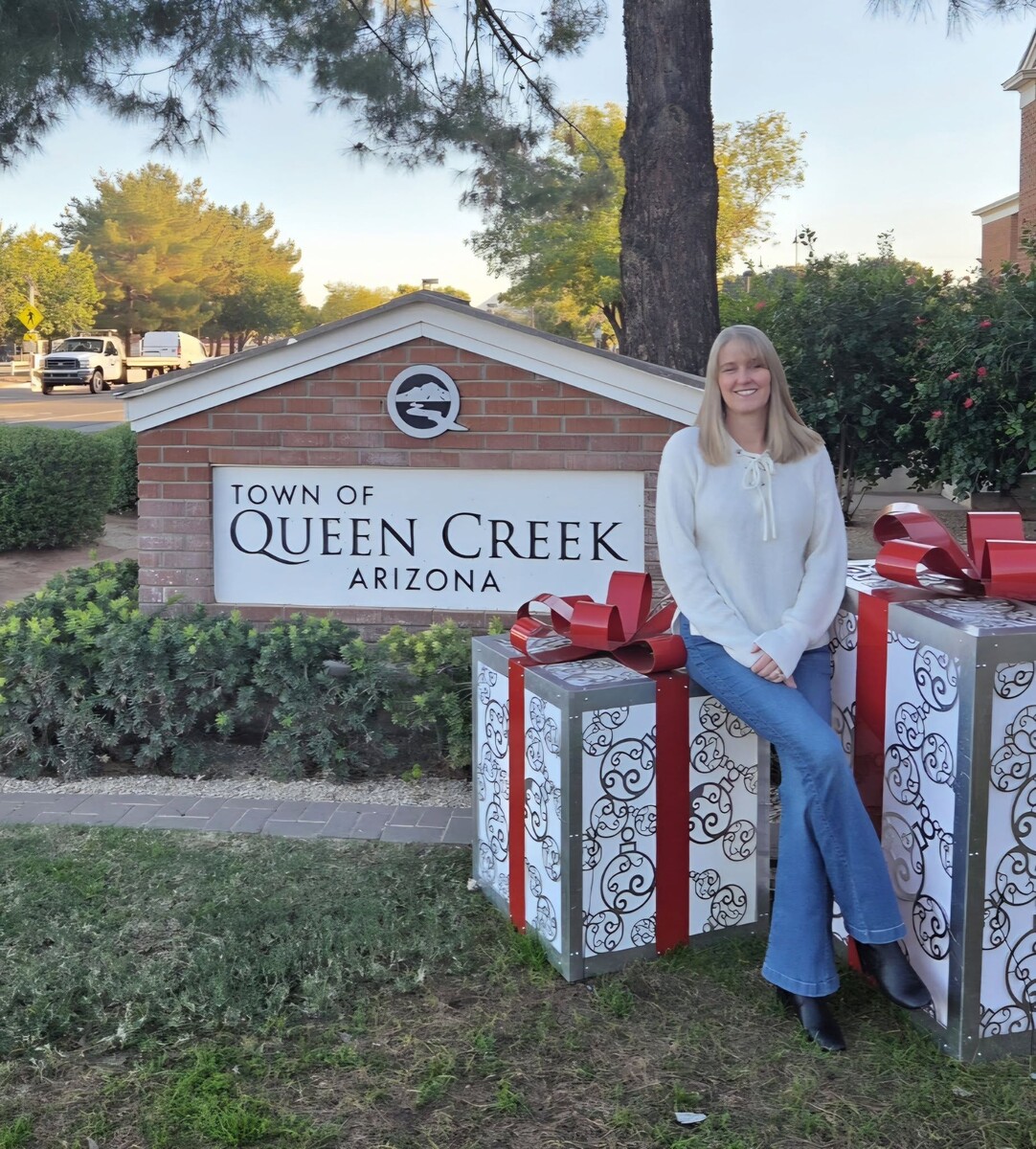 Dawn Oliphant at the Town of Queen Creek sign